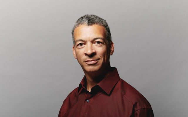 A man in a maroon shirt.