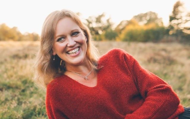 A woman in a red jumper,