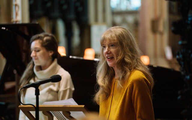 Two women singing.