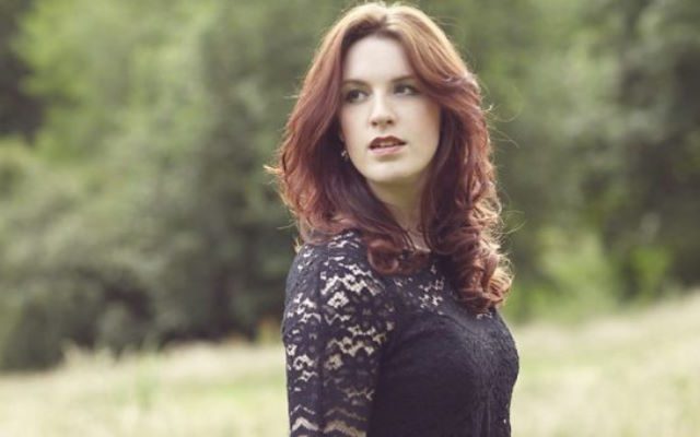 A woman with red hair.