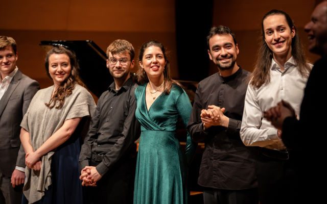 A group of people in formal dress.